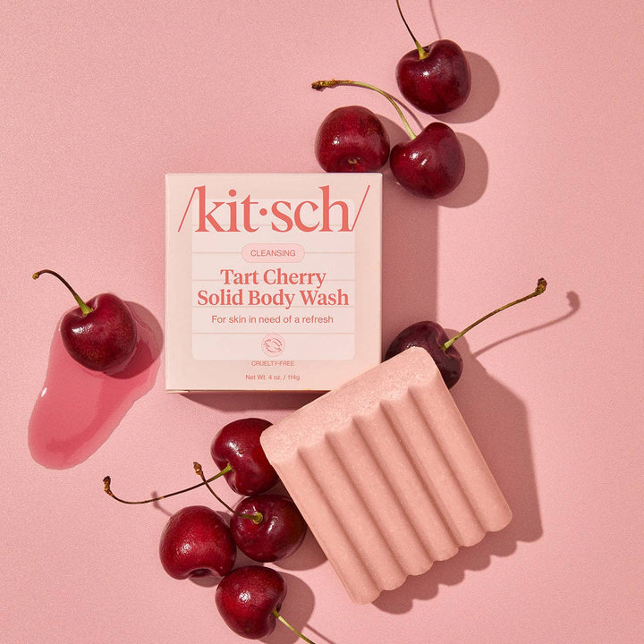 Kit-Sch Tart Cherry Solid Body Wash with cherries on a pink background