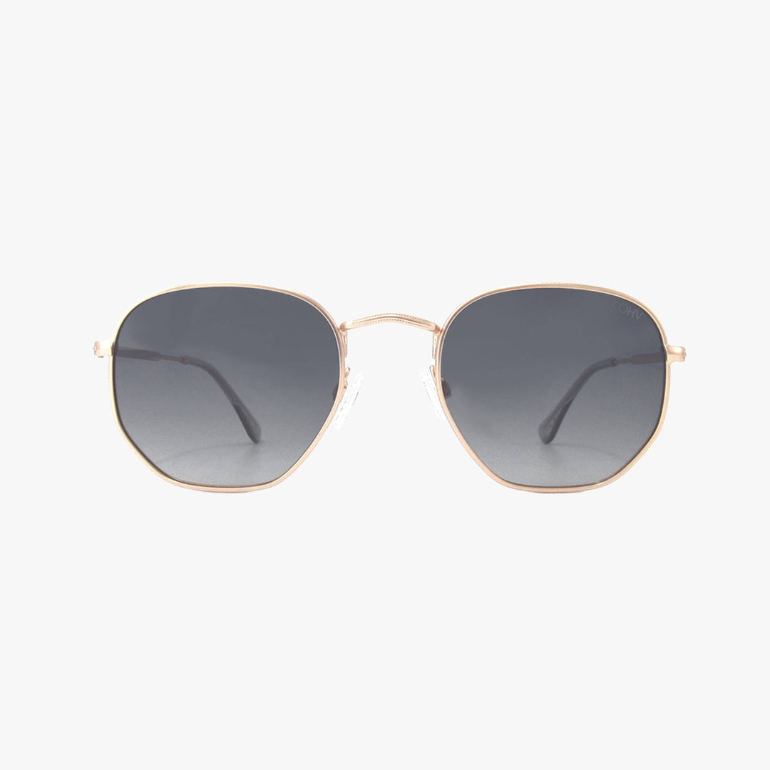 Sunglasses with gold frame and dark lenses on a white background