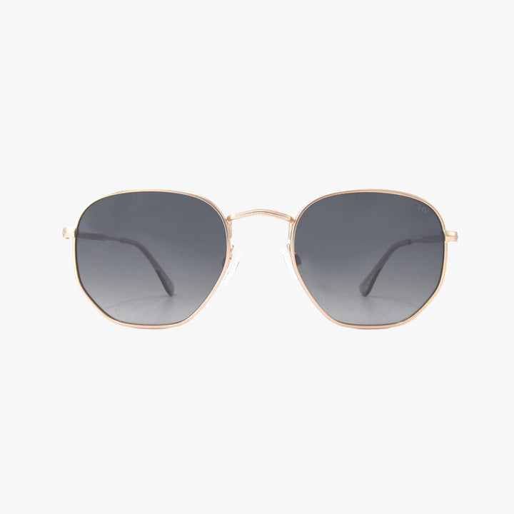 Sunglasses with gold frame and dark lenses on a white background