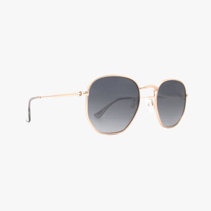 Sunglasses with gold frame and dark lenses on a white background