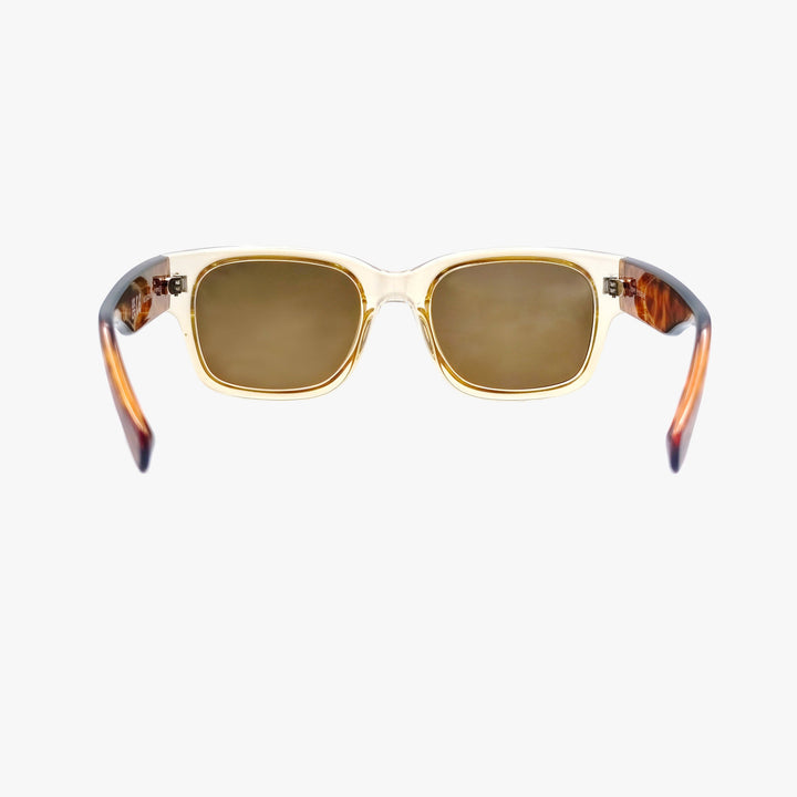 Sunglasses with gold frame and brown lenses on a white background
