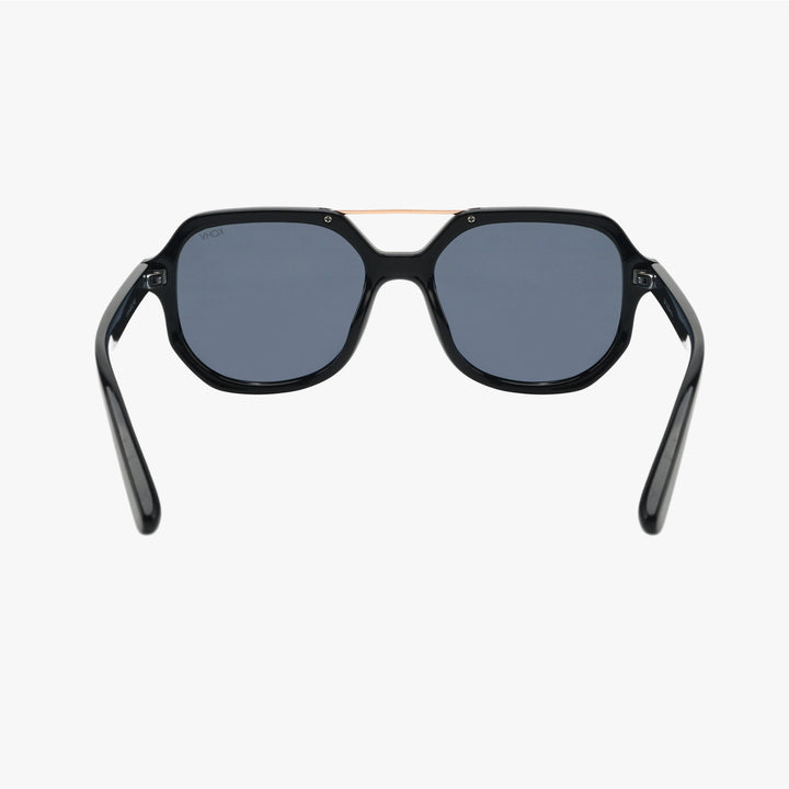 Black sunglasses with dark lenses on a white background