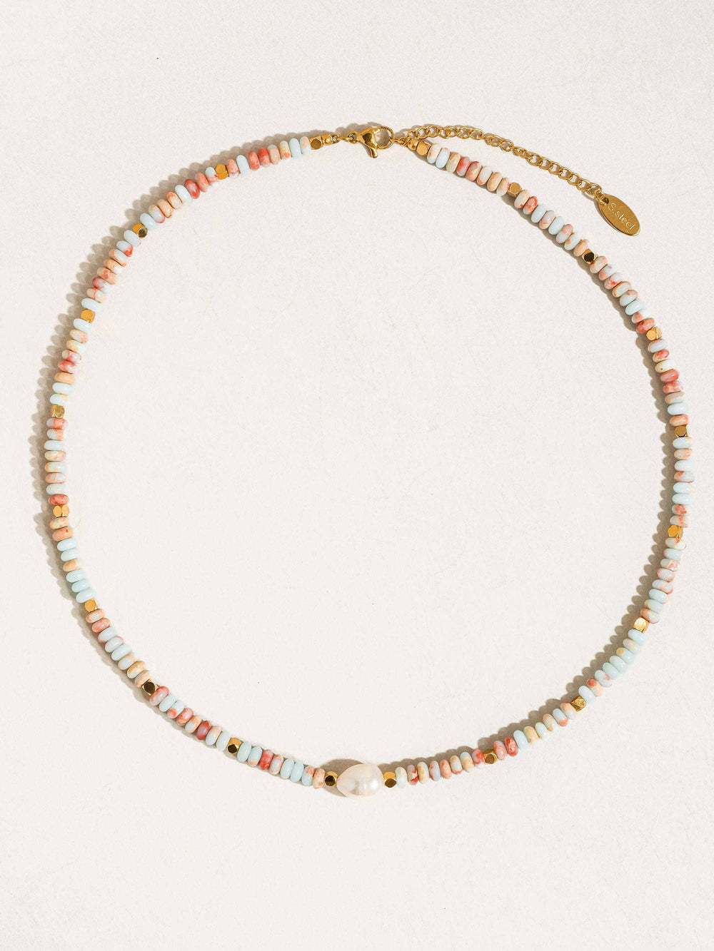 Necklace with multicolored beads on a white background