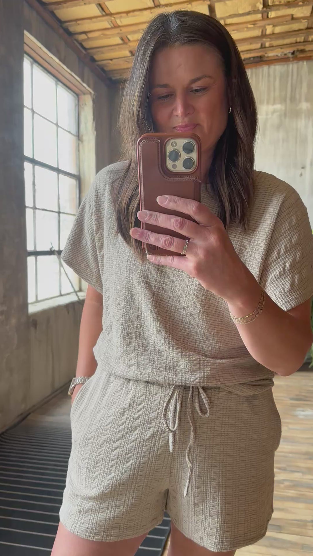 Video of model wearing textured knit top & shorts set with elastic waist in the color taupe